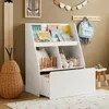 A child's room with a white bookshelf filled with books and toys, a growth chart on the wall, and a woven basket. Náhľad obrázku produktu