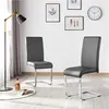A set of two modern gray dining chairs with chrome legs, displayed in a well-lit room with artwork on the wall and a floor lamp. Anteprima dell’immagine prodotto