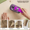 A hand holding a portable garment steamer over a beige fabric, with additional close-up images of trench coat details. Produktbild-Vorschau