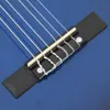 A close-up view of the bridge and strings of a blue guitar. Produktbild-Vorschau