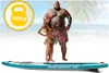 A man and a child stand on a paddleboard on a beach. Náhled obrázku produktu
