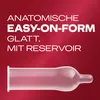 A close-up marketing image of a condom against a red gradient background, with text describing its features. Náhľad obrázku produktu