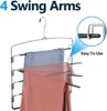 A multi-tiered metal hanger designed for organizing pants, with two pairs of pants shown hanging on it. Produktbild-Vorschau