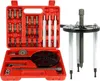 A red toolbox containing various automotive tools, with a separate tool assembly to the right. Podgląd zdjęcia produktu