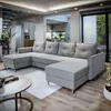 A modern living room with a large sectional sofa. Podgląd zdjęcia produktu