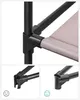 Close-up of a black metal frame and beige fabric shelf of a storage unit, with detail shots of connectors. Náhled obrázku produktu
