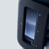 A close-up view of a black baby bottle maker with a blue screen. Podgląd zdjęcia produktu
