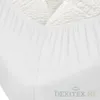 A close-up view of a white fitted sheet, showing the elasticized edge and textured fabric. Produktbild-Vorschau