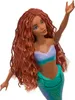 A doll with long, braided red hair and a mermaid tail. Podgląd zdjęcia produktu