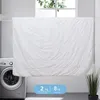 A white duvet is hanging on a clothesline in front of a window, with a washing machine to the left and a potted plant to the right. There are two blue boxes with text and numbers at the bottom. Náhľad obrázku produktu