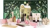 A beauty advent calendar with makeup and accessories displayed in front of the calendar. Produktbild-Vorschau