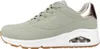 Side view of a green Skechers Uno sneaker with a white sole and brown outsole. Voir les images du produit