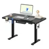 A black standing desk with a computer monitor, keyboard, mouse, and accessories. Voir les images du produit