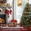 A decorated Christmas tree and fireplace scene with gifts and stockings. Produktbild-Vorschau