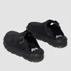A pair of black Dr. Martens Zebzag clogs are shown against a white background. Produktbild-Vorschau