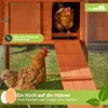 Two chickens are in and around a wooden chicken coop with a ramp. Produktbild-Vorschau