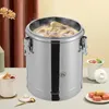 A large stainless steel insulated soup container is shown on a table, with steam rising from the top. Several small bowls of food and some square food items are arranged around it. Produktbild-Vorschau