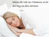 A woman sleeping peacefully in bed with her hands clasped. Produktbild-Vorschau