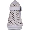 A white bootie with a decorative laser-cut pattern and a buckle strap. Produktbild-Vorschau