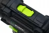 A close-up view of a black and green power tool, likely a drill or screwdriver, with a bright green button or indicator visible. Podgląd zdjęcia produktu