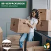 A woman is holding a moving box in a room with other boxes. Produktbild-Vorschau