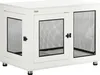 A white dog crate with black mesh panels and silver feet, shown from a three-quarter front view. Podgląd zdjęcia produktu