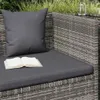 A close-up view of a grey rattan garden sofa with cushions and an open book. Podgląd zdjęcia produktu