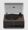 A turntable with a wooden base and a clear dust cover, shown from a front-facing angle against a light gray background. Anteprima dell’immagine prodotto