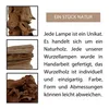 A collage of three images of driftwood with accompanying text describing the uniqueness of lamps made from natural wood. Produktbild-Vorschau