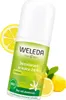 A roll-on deodorant bottle with lemons and leaves in the background. Anteprima dell’immagine prodotto
