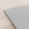A close-up view of a gray shower tray on a light wooden floor. Produktbild-Vorschau