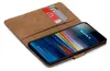 A brown book-style phone case with two cards inserted, displaying a Sony Xperia 1 phone screen. Anteprima dell’immagine prodotto