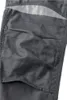 A close-up view of a gray work pant pocket with reflective detailing. Produktbild-Vorschau