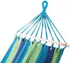 Close-up of a striped hammock hanging from blue ropes. Produktbild-Vorschau