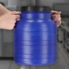 Hands holding a blue plastic barrel with a black lid. Podgląd zdjęcia produktu