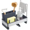 A kitchen sink organizer with various cleaning tools and supplies. Náhled obrázku produktu
