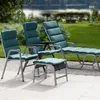 Outdoor furniture set with chairs and a chaise lounge on a patio next to a body of water. Produktbild-Vorschau
