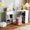 A white L-shaped desk with shelves and a pink stool in a home office setting. Podgląd zdjęcia produktu