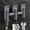 A close-up studio shot of a triple outlet valve with accompanying accessories against a dark, textured background. Anteprima dell’immagine prodotto