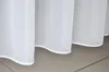 A close-up view of the bottom edge of white sheer curtains hanging down. Produktbild-Vorschau