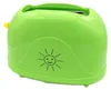 A bright green toaster with a yellow lever and a smiley sun graphic on its side, set against a white background. Produktbild-Vorschau