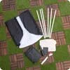 A disassembled portable ice bath kit laid out on a surface of artificial grass and wooden tiles. Produktbild-Vorschau