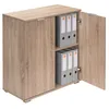 A wooden cabinet with two doors, one of which is open, revealing shelves with binders inside. Produktbild-Vorschau