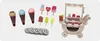 A collection of wooden toy ice cream cones, popsicles, and a toy ice cream cart. Produktbild-Vorschau