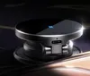 A close-up shot of a black wireless charger with a blue lightning bolt indicator light and a USB-C port. Podgląd zdjęcia produktu
