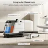 A carpet cleaning machine with its accessories is shown on a carpet in a living room setting. Anteprima dell’immagine prodotto