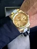 A close-up shot of a gold Guess watch on a person's wrist. Anteprima dell’immagine prodotto