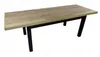 A rectangular table with a wooden top and black metal legs, shown from a diagonal angle against a white background. Náhled obrázku produktu