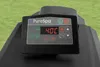A close-up view of a PureSpa control panel on a black spa unit, set against a green grassy background. Náhľad obrázku produktu