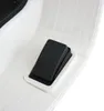 A close-up view of a black pedal on a white electric scooter. Podgląd zdjęcia produktu